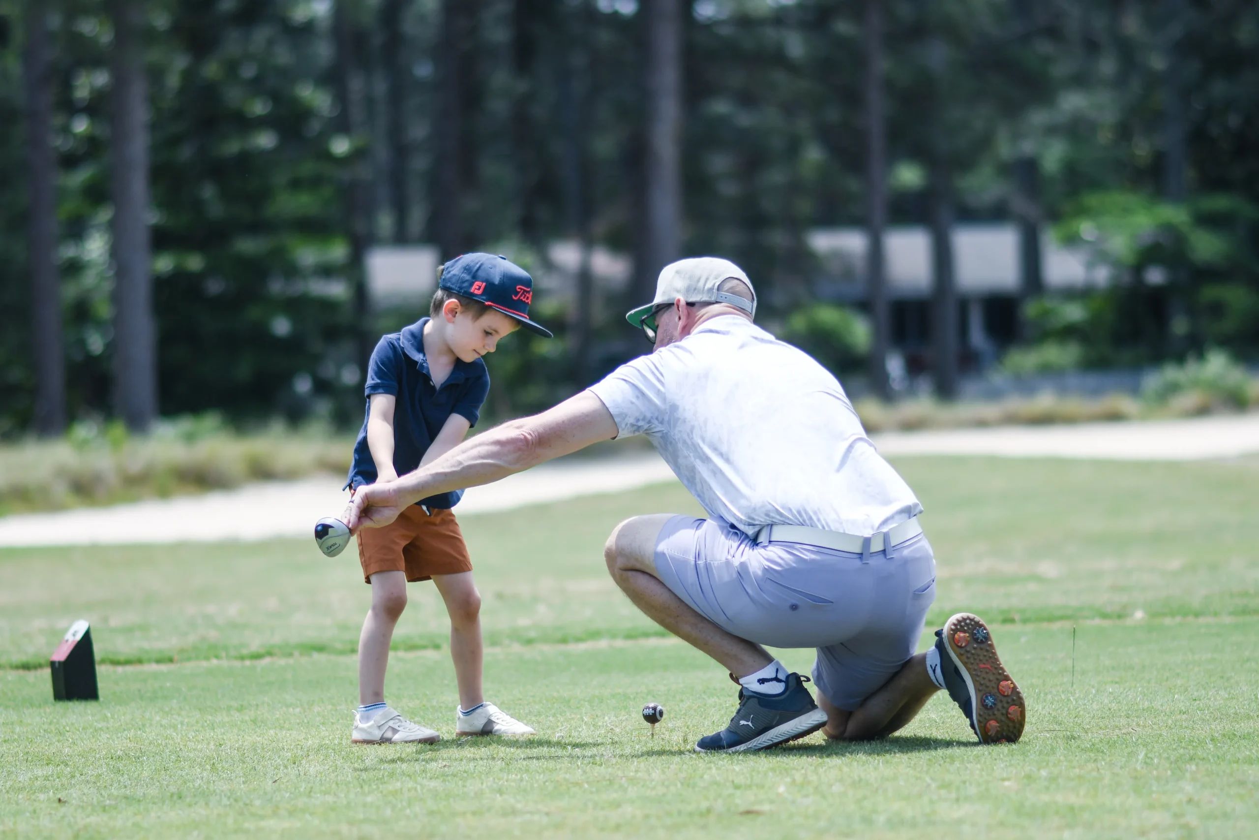 Young child focused on a golf drill - The Caddie Code Parent Ecosystem